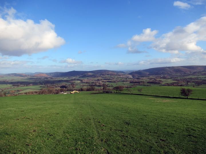 A view of hills in the distance on a sunny day.